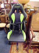 AN AK RACING GREEN AND BLACK GAMING STYLE SWIVEL ARMCHAIR