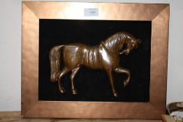 A BRONZE TYPE WALL MOUNTABLE PLAQUE OF A HORSE