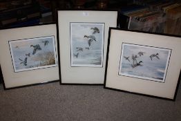 THREE FRAMED AND GLAZED SIGNED JOHN CYRILL HARRISON PRINTS WITH BLIND STAMPS DEPICTING DUCKS FLIGHT