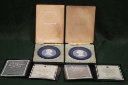 A PAIR OF WEDGWOOD JASPERWARE THREE COLOUR ROYAL SILVER JUBILEE PLAQUES