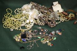 TWO SMALL TINS OF ASSORTED COSTUME JEWELLERY