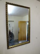 A GILT FRAMED RECTANGULAR MIRROR 71 X 44 CM