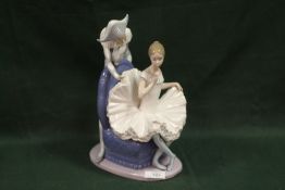A LARGE NAO 'A DREAM COME TRUE' FIGURE OF A SEATED BALLERINA WITH A JESTER BEHIND