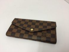 LOUIS VUITTON - a brown / beige purse