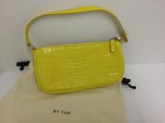 BY FAR - a yellow handbag