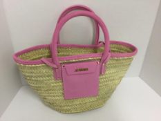 JACQUEMUS - a pink wicker bag