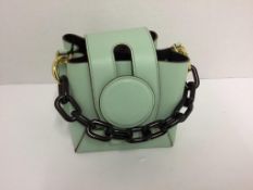 YUZEFI - a mint green bag