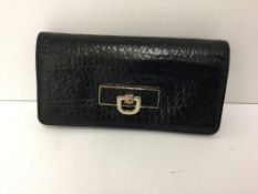 DKNY - a black purse with gold clasp (discolouration to clasp)