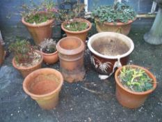 A COLLECTION OF NINE PLANTERS TO INCLUDE A CHIMNEY POT