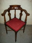 AN ANTIQUE OAK CORNER CHAIR