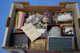 A BOX OF ASSORTED COSTUME JEWELLERY
