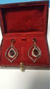 A PAIR OF DROP EARRINGS STAMPED 585 AND 925 SET WITH GARNETS AND DIAMONDS, BOXED