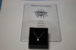 A CERTIFICATED FINE QUALITY 18 CT WHITE GOLD RBC DIAMOND SOLITAIRE PENDANT AND 18 CT WHITE GOLD