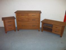 AN OAK FIVE DRAWER CHEST OF DRAWERS (TWO OVER TWO OVER ONE), AN OAK MEDIA UNIT AND AN OAK THREE