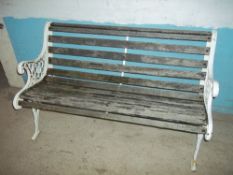 A CAST IRON GARDEN BENCH