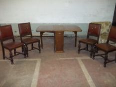 A 1920S DROP LEAF STORAGE TABLE AND FOUR CHAIRS IN OAK