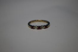 A 9 CT YELLOW GOLD FIVE STONE RUBY AND DIAMOND RING