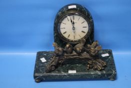 A MARBLE EFFECT CLOCK WITH BIRDS ON LOG