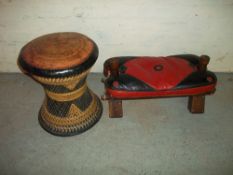 AN ANTIQUE CAMEL STOOL TOGETHER WITH ANOTHER LEATHER TOPPED ROUND STOOL