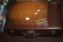A VINTAGE SUITCASE AND A CANTEEN OF CUTLERY