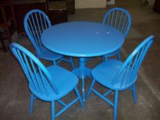 A BLUE CIRCULAR SINGLE PEDESTAL DINING TABLE WITH FOUR CHAIRS