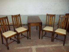 A DROP LEAF WOODEN TABLE AND FOUR CHAIRS 1930S/40S