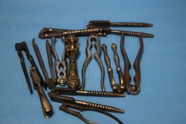 A COLLECTION OF ANTIQUE NUT CRACKERS, to include a pair with Lincoln Imp design