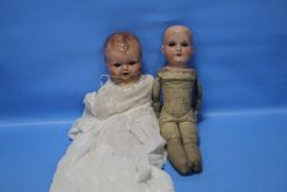 A VINTAGE ARMAND MARSEILLE PORCELAIN HEADED DOLL TOGETHER WITH ANOTHER A/F
