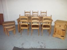 A CORONA STYLE LARGE DINING TABLE WITH SIX CHAIRS, A NEST OF THREE TABLES AND A CUPBOARD UNIT (3)