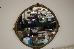 A FRAMED AND GLAZED CIRCULAR MIRROR APPROX. 72 X 72 CM