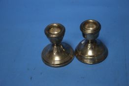A PAIR OF HALLMARKED SILVER DWARF CANDLESTICKS