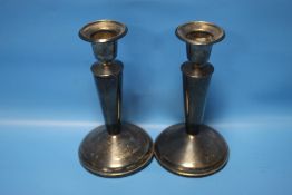 A PAIR OF HALLMARKED SILVER CANDLESTICKS