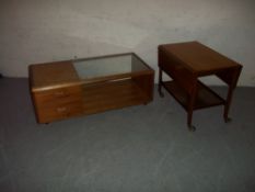 A RETRO TEAK / GLASS COFFEE TABLE AND A TEAK DROPLEAF SERVING TROLLEY