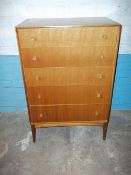 A TEAK RETRO FIVE DRAWER CHEST ON LEGS