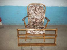 A BLONDE EASY CHAIR IN THE STYLE OF ERCOL AND AN ERCOL PLATE RACK