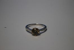 18 CT WHITE GOLD ROUND CUT FANCY DIAMOND RING WITH RBC DIAMOND SHOULDERES AND A FANCY BROWN
