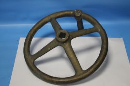 A BRASS/BRONZE FOUR SPOKE FLY WHEEL POSSIBLY FROM A WWI ARTILLERY PIECE D 30.5 cm