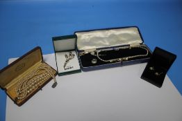 TWO PEARL NECKLACES, A BROOCH AND A PAIR OF EARRINGS