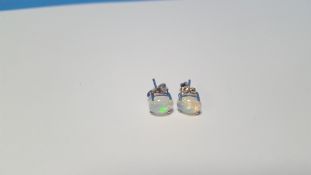A PAIR OF CABOCHON WHITE OPAL SILVER STUDS