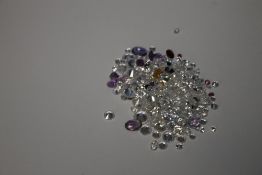 A BAG OF LOOSE MIXED STONES INCLUDING CUBIC ZIRCONIA, RUBY, SAPPHIRE, AMETHYST AND CITRINE, 93.8 CT