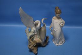 A NAO FIGURINE AND A HERON GROUP
