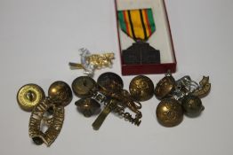 A BELGIUM MILITARY COMBATANTS CROSS MEDAL 1940-45 and a quantity of military badges and buttons.