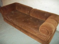 A BROWN SOFA BED