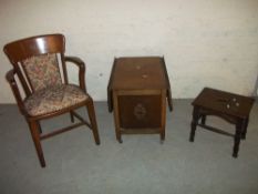 AN ANTIQUE OAK STOOL, AN ANTIQUE OAK CHAIR BY MANOR CABINET WORKS AND AN ANTIQUE OAK DROP LEAF