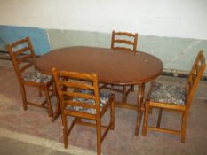 AN OAK FINISH MODERN TABLE AND FOUR CHAIRS