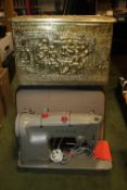 A CASED SINGER SEWING MACHINE AND A BRASS EFFECT COAL BOX