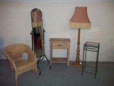 A WICKER CHAIR, A HEAVY OAK STANDARD FLOOR LAMP, A CHROME FLOOR STANDING DRESSING MIRROR, AN OAK
