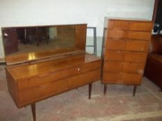 A RETRO TEAK DRESSING TABLE AND SIX DRAWER CHEST