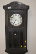 AN OAK CASED WALL CLOCK A/F