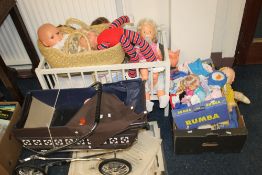 SEVEN LARGE VINTAGE DOLLS PLUS A DOLL IN A MOSES BASKET also including two dolls cots and a blue